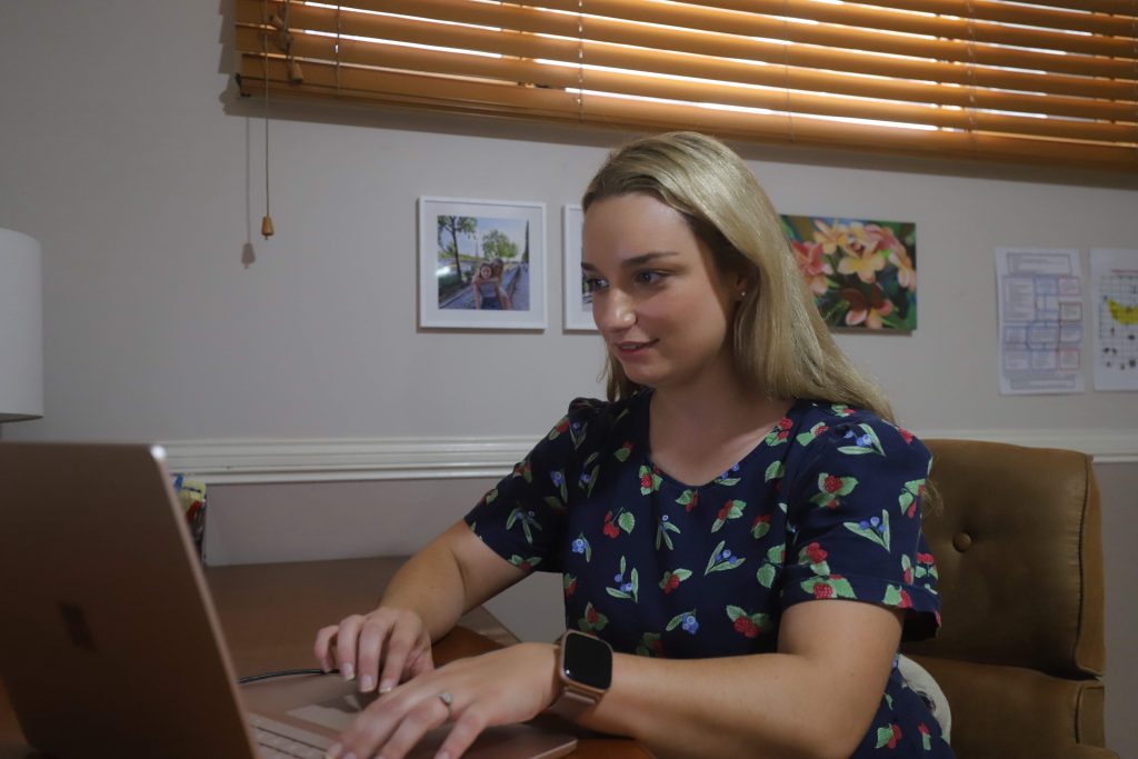 Mollie working on laptop